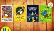 Holzwand mit vier Oktoberfestplakaten der vergangenen Jahre